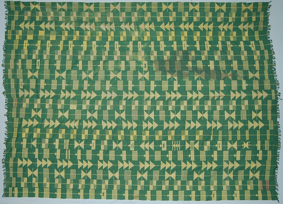 Adire eleko cloth showing starch-resist patterns in indigo dye, with figurative and geometric motifs, from Abeokuta, Yorubaland