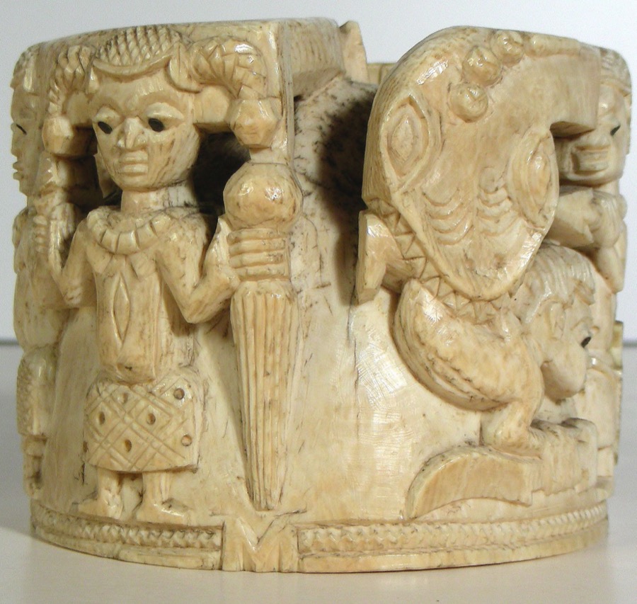 Ivory lid from Owo — British Museum, snake swallowing a man and other carved figures